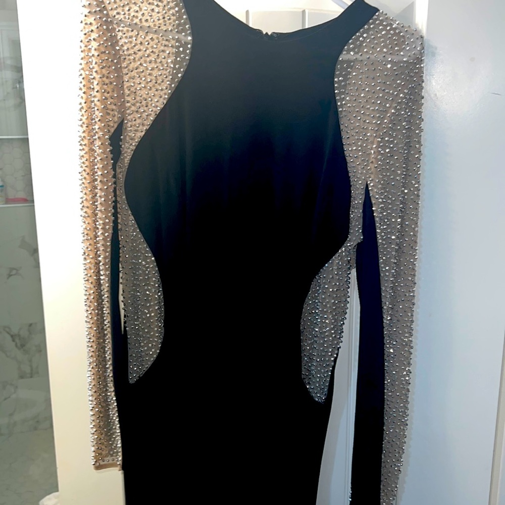 Selling a black, long sleeve dress..